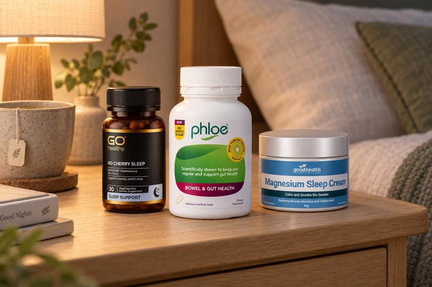 Phloe No Added Sugar Chewables, GO Cherry Sleep and Good Health Magnesium Sleep Cream on a bedside table in evening lamplight
